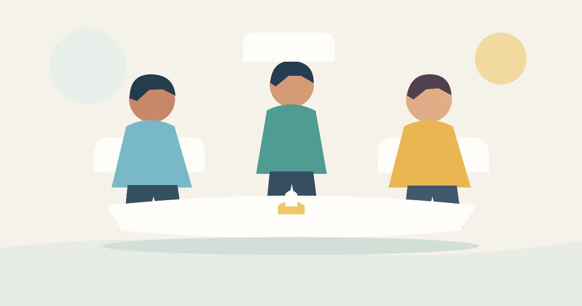 Mediadora facilitando una conversación entre dos personas en una mesa